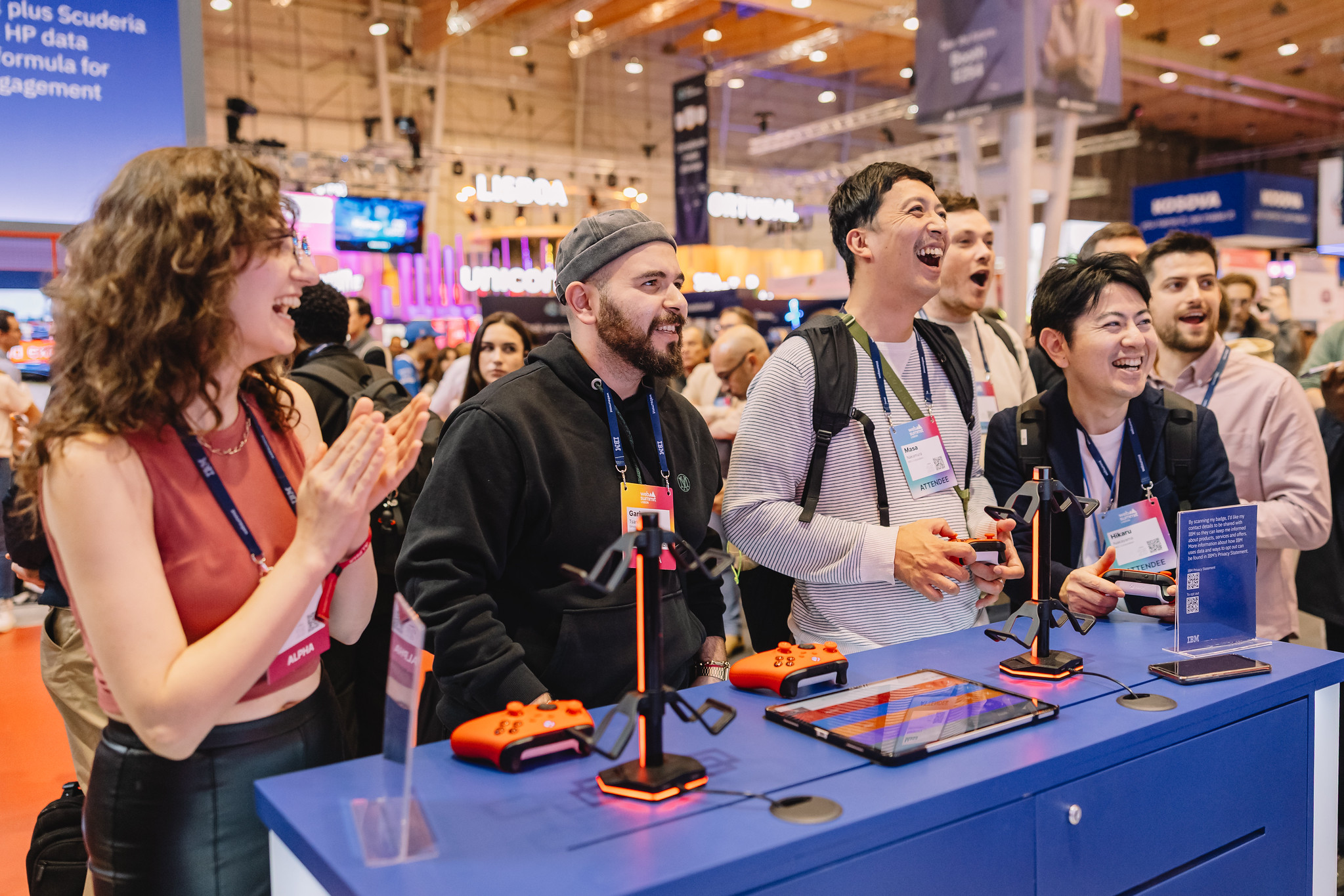 Attendees playing videogames at the IBM Happy Hour